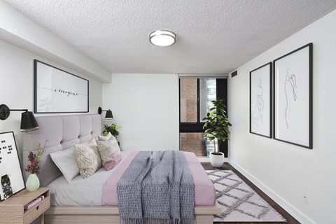 Spacious bedroom with corner window at 57 Charles
