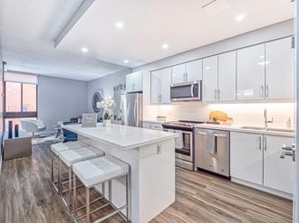 Open-concept kitchen in a renovated unit at  57 Charles