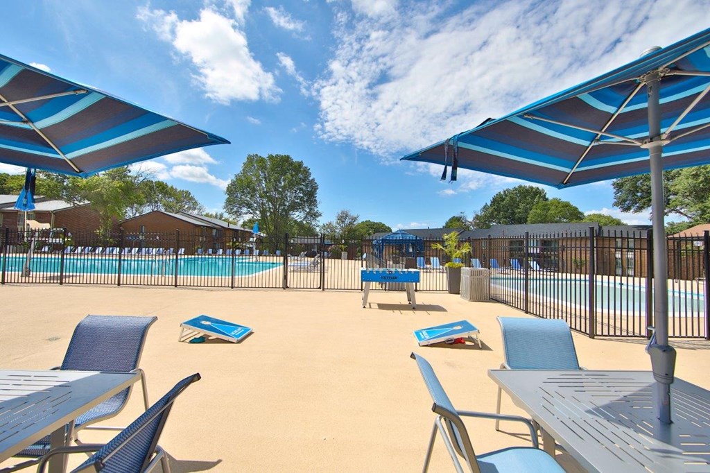 our apartments have a large patio with umbrellas and tables