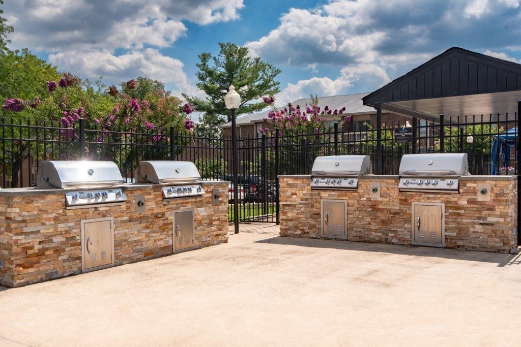 two outdoor grills in front of a grill