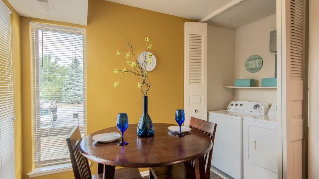 a dining room with a table and a window