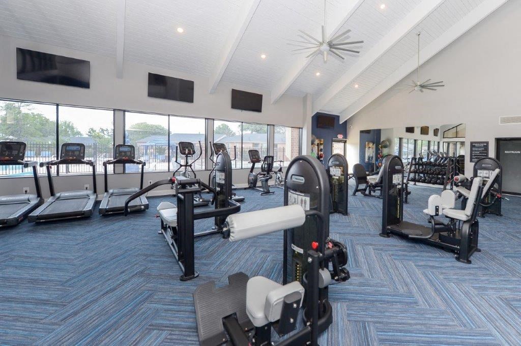 a gym with a view of the water in the background