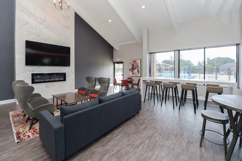 a living room with a couch and a table with chairs