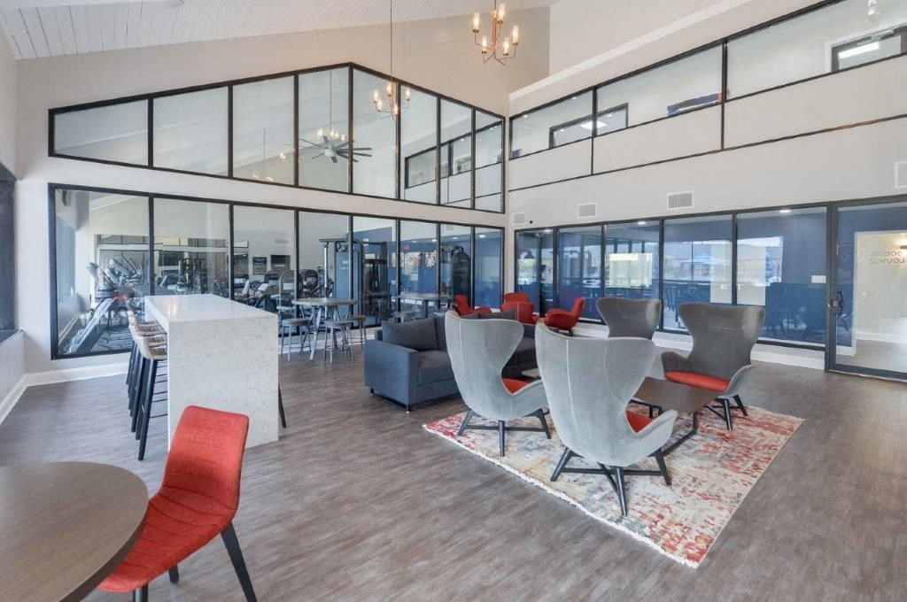 a room with a table and chairs and a lobby