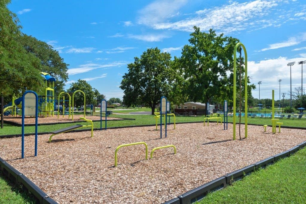 a playground at a park on a sunny day