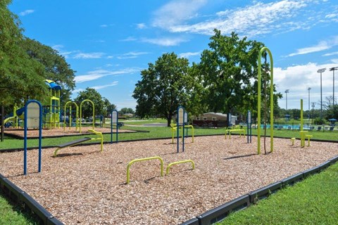 a playground at a park on a sunny day