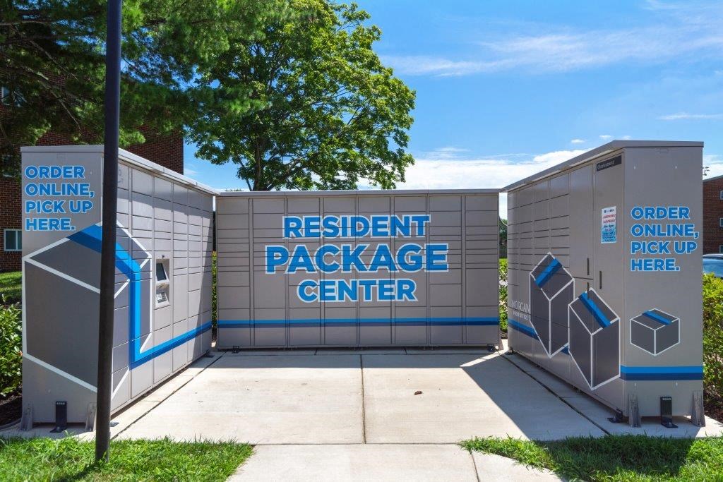 the outside of the resident package center with restrooms and a sign