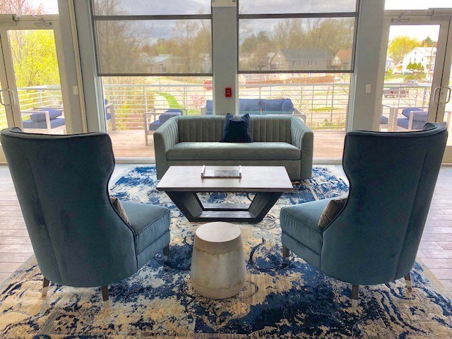 a living room with couches and chairs and a coffee table
