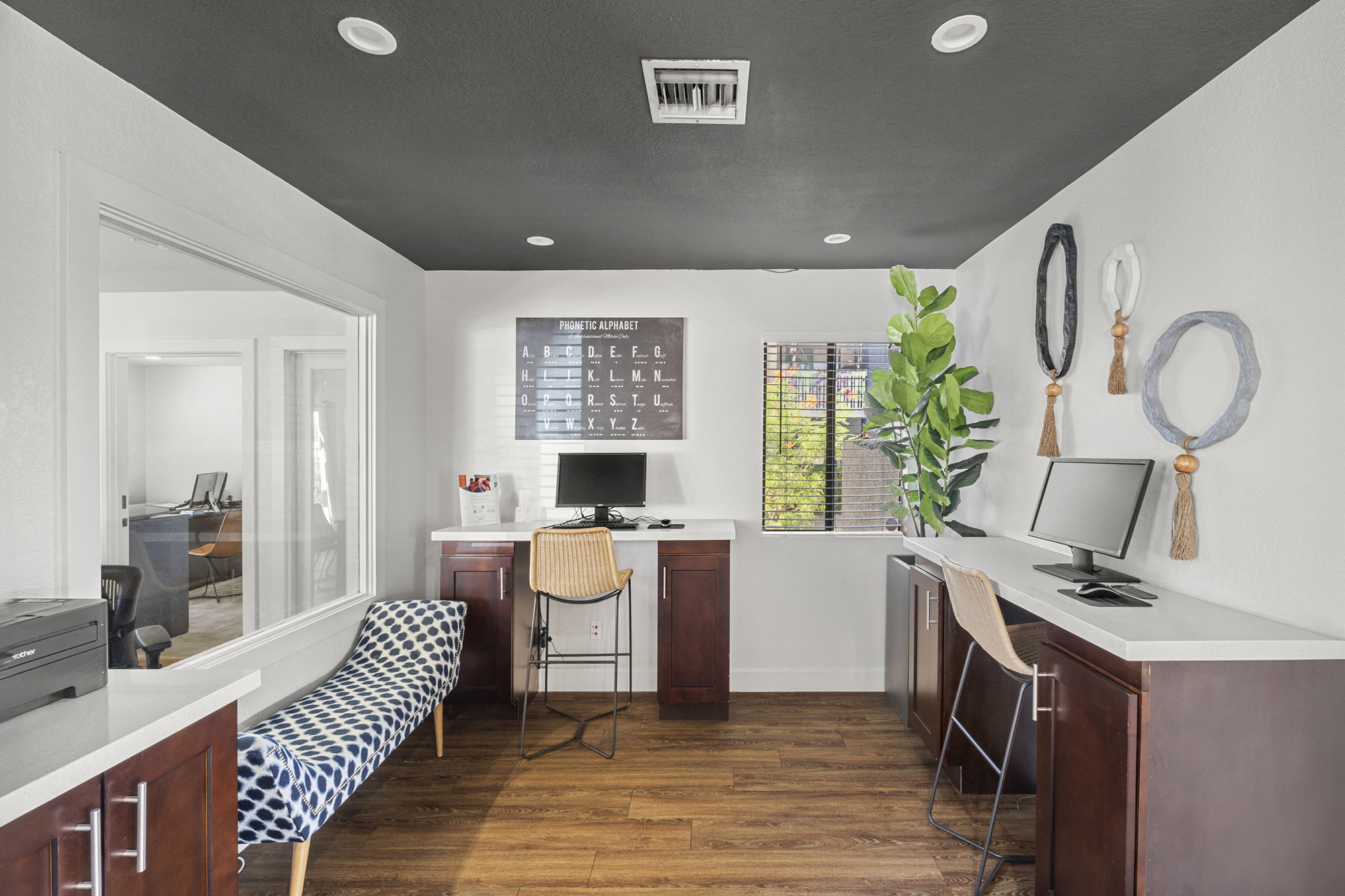 an office with a desk and a chair and a window