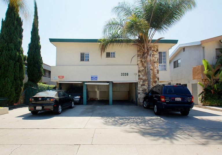 two cars parked in front of a building