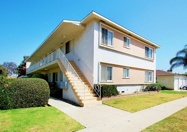 A two-story house with a staircase leading to the second floor.