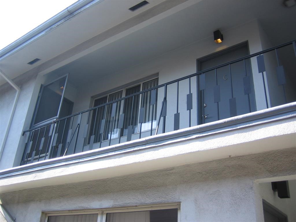 the balcony of the apartment is clean and ready for guests