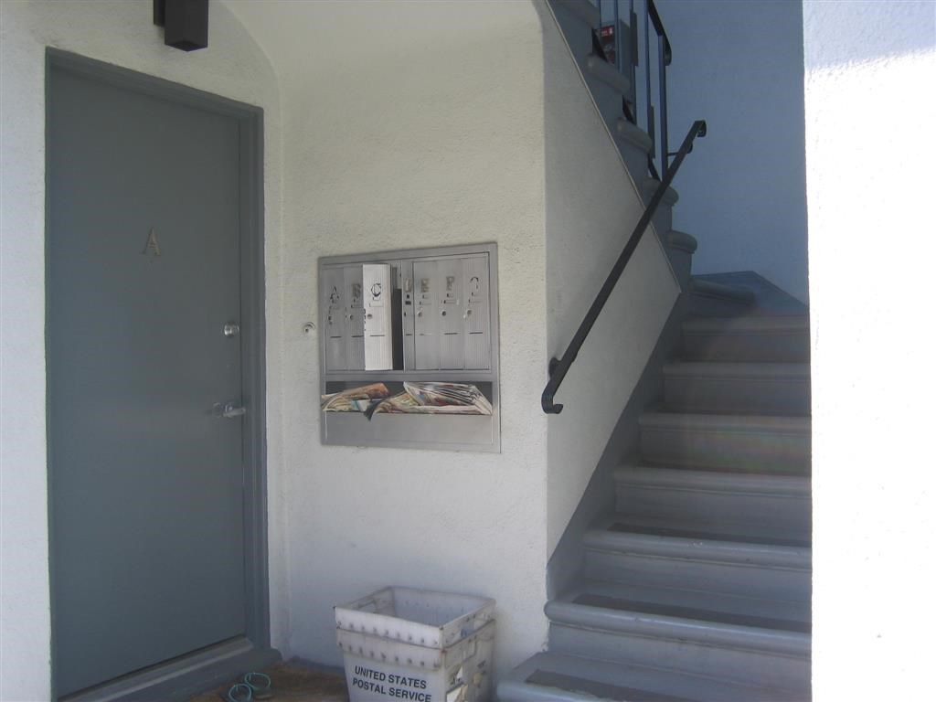a staircase in a house with a door and some steps