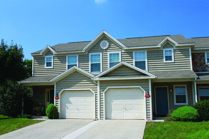 a large house with two garage doors