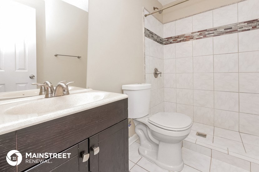 a bathroom with a toilet and a sink