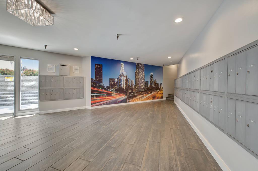 a locker room with a mural of a city on the wall