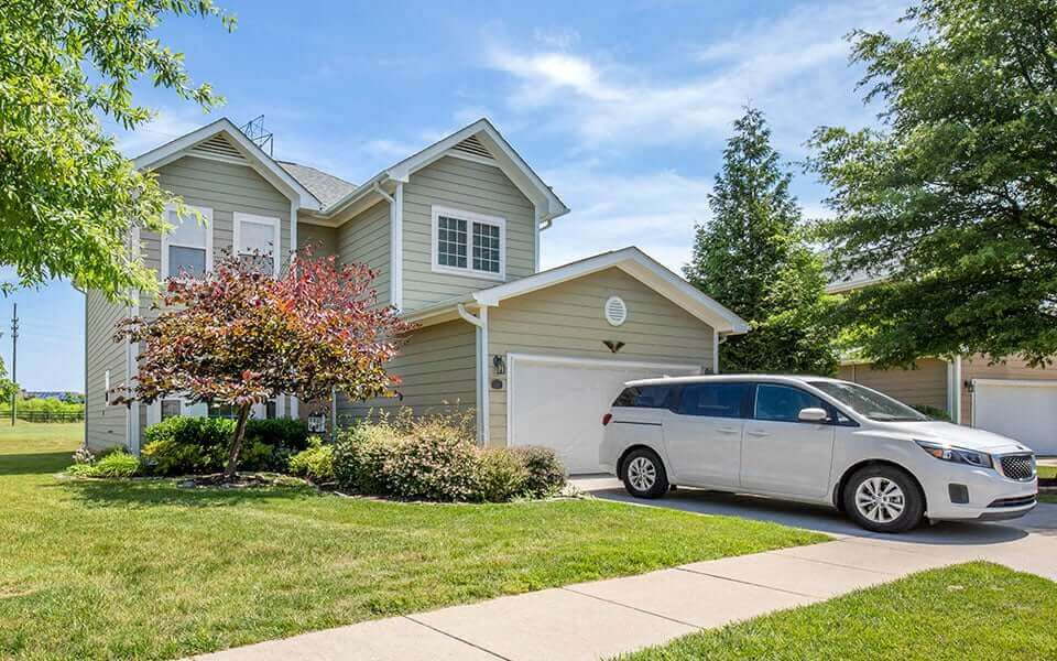a house with a van parked in front of it