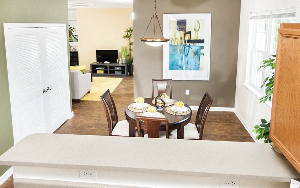 a dining room with a table and chairs