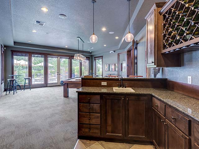 Fife, WA Apartments for Rent - Bella Sonoma - Billiards Room with Billiards Table, Kitchenette, and Floor-to-Ceiling Windows