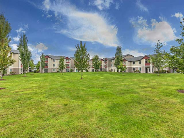 Fife Apartments for Rent-Bella Sonoma Apartments Lush Green Landscaping Of Community With Maintained Grass And Trees