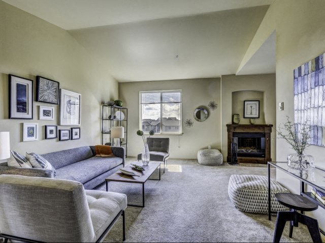 Fife WA Apartments - Open Space Living Room with Carpeted Floors Featuring Stylish Interior