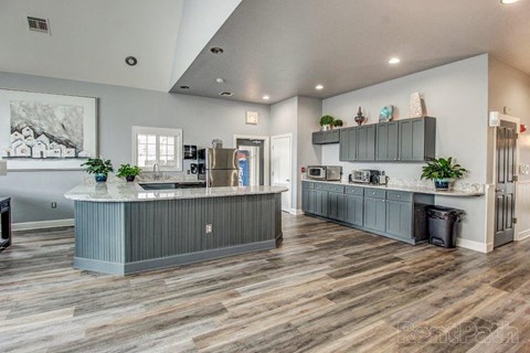 a kitchen with a counter top and a refrigerator