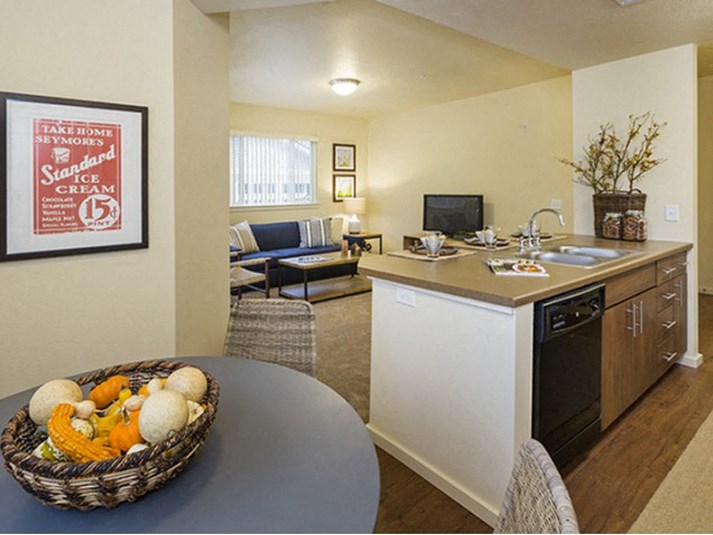Full kitchen with dining area view Parker CO Apartment Rentals at Copper Steepe 