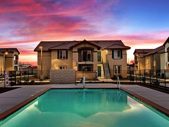 Pool near building l Cordova Apartments in Selma CA