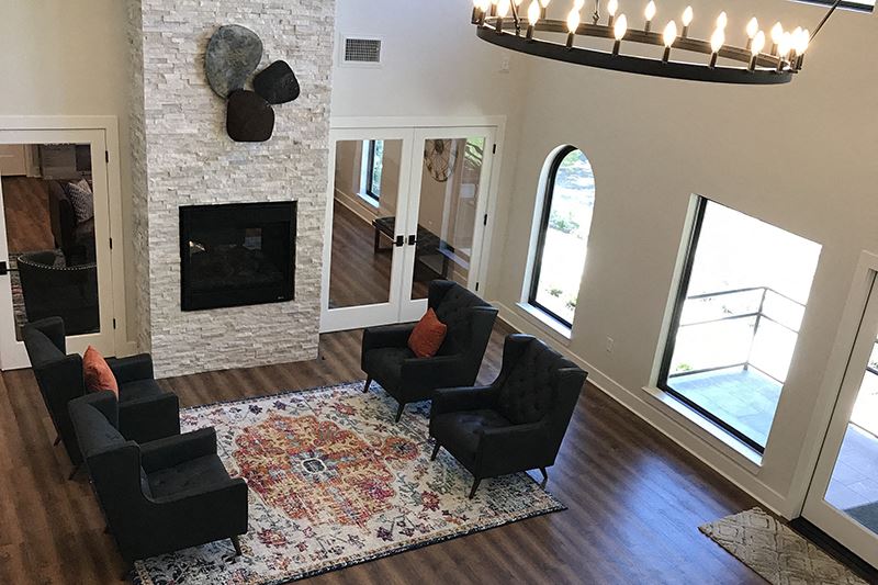 Leasing office seating by fireplace Round Rock, TX Apartment l The Creek - Photo Gallery 1