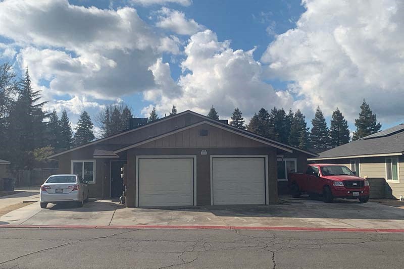 Exterior view of building with garages