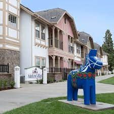 Community monument sign with art statue