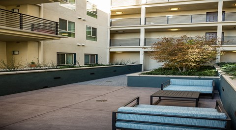 Seating in courtyard  l The Meridian Apartments in Los Angeles, CA
