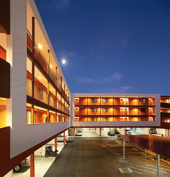 View of exterior building and parking  l Mission Apartments in San Diego CA