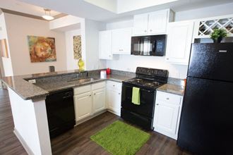 Modern Kitchen at Monroe Place Apartments, Atlanta, GA - Photo Gallery 3