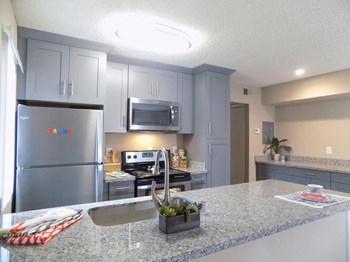 Full kitchen view Sacramento CA 95814 Apts For rent at The Palms - Photo Gallery 5