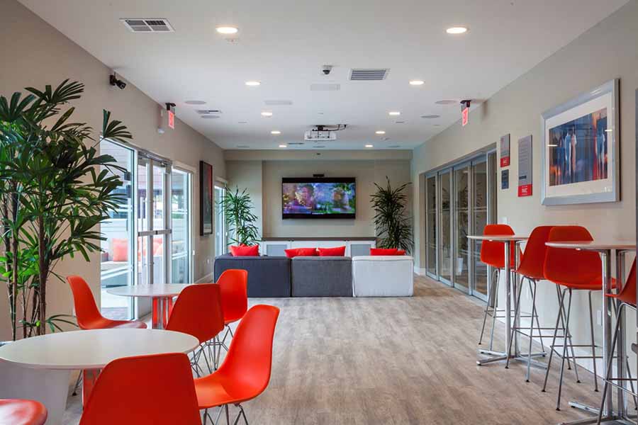 Apartments Campbell - Large Community Clubhouse with Plush Seasing, Tables, and TV