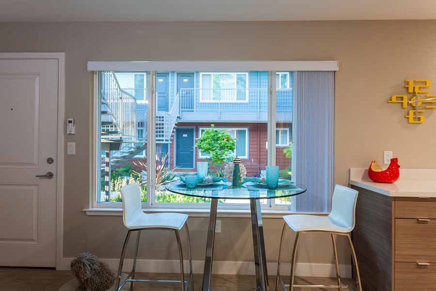 Apartments for Rent in Campbell- Parc at Pruneyard- Glass Dining Table with Spacious Window and Neutral Walls