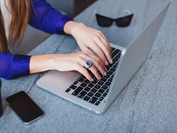 PEARL CREEK | Person on computer l Pay Online - Photo Gallery 4