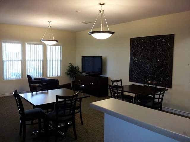 Community room with TV l Santa Fe Apartments in Bakersfield CA