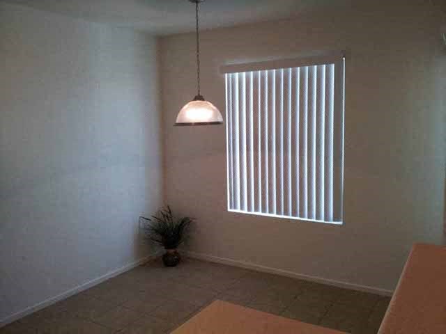 Bedroom with window   l Santa Fe Apartments in Bakersfield CA
