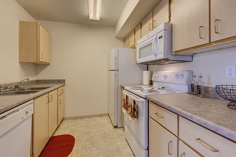 a kitchen with a stove microwave and refrigerator