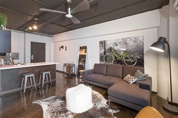 Apartments in Sparks NV - Square One - Spacious Living Area with Open-Concept Floorplan, White Walls, and Industrial Design - Photo Gallery 6