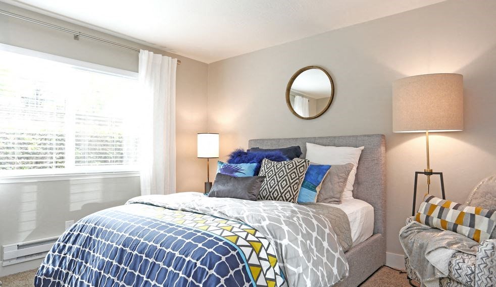 Walnut Creek Apartments for Rent - Stoneridge - Bedroom with Large Window, Plush Carpet, and Stylish Decor