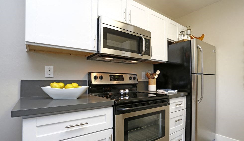 Kitchen with view of oven and appliances 