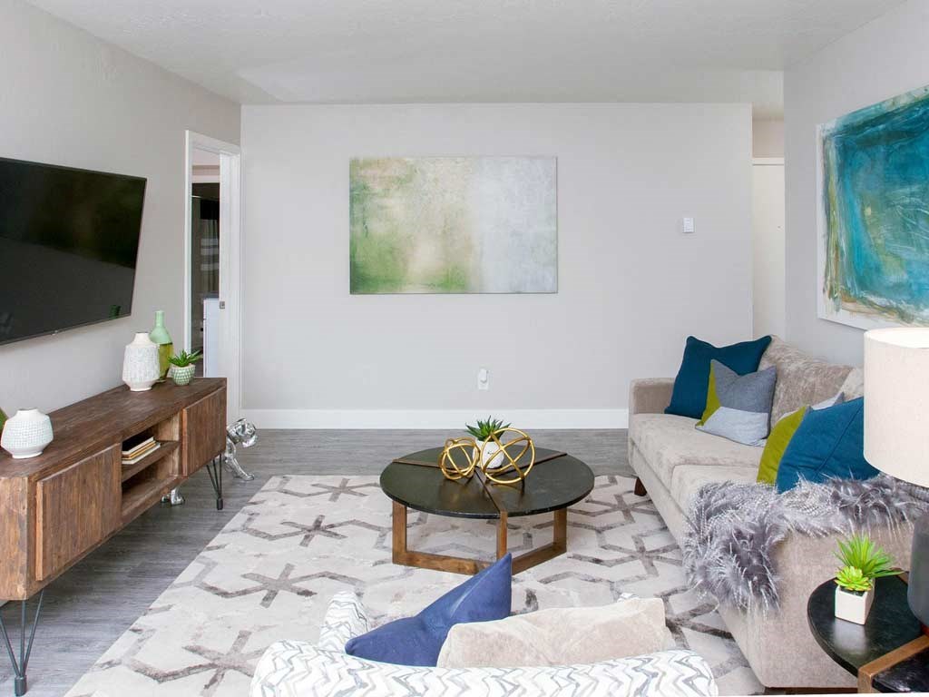 Walnut Creek, CA Apartments for Rent - Stoneridge - Living Room with High Ceilings, Wood Style Flooring, and Stylish Decor