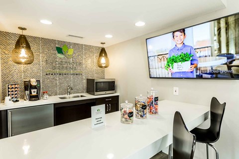 a kitchen with a counter and a tv