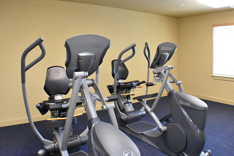 Gym with cardio equipment Traditions at Englewood Senior Apts for rent in Englewood CO