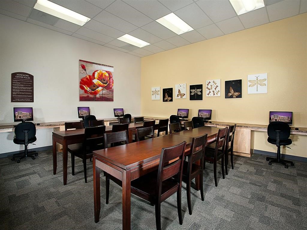 a conference room with a long table and chairs
