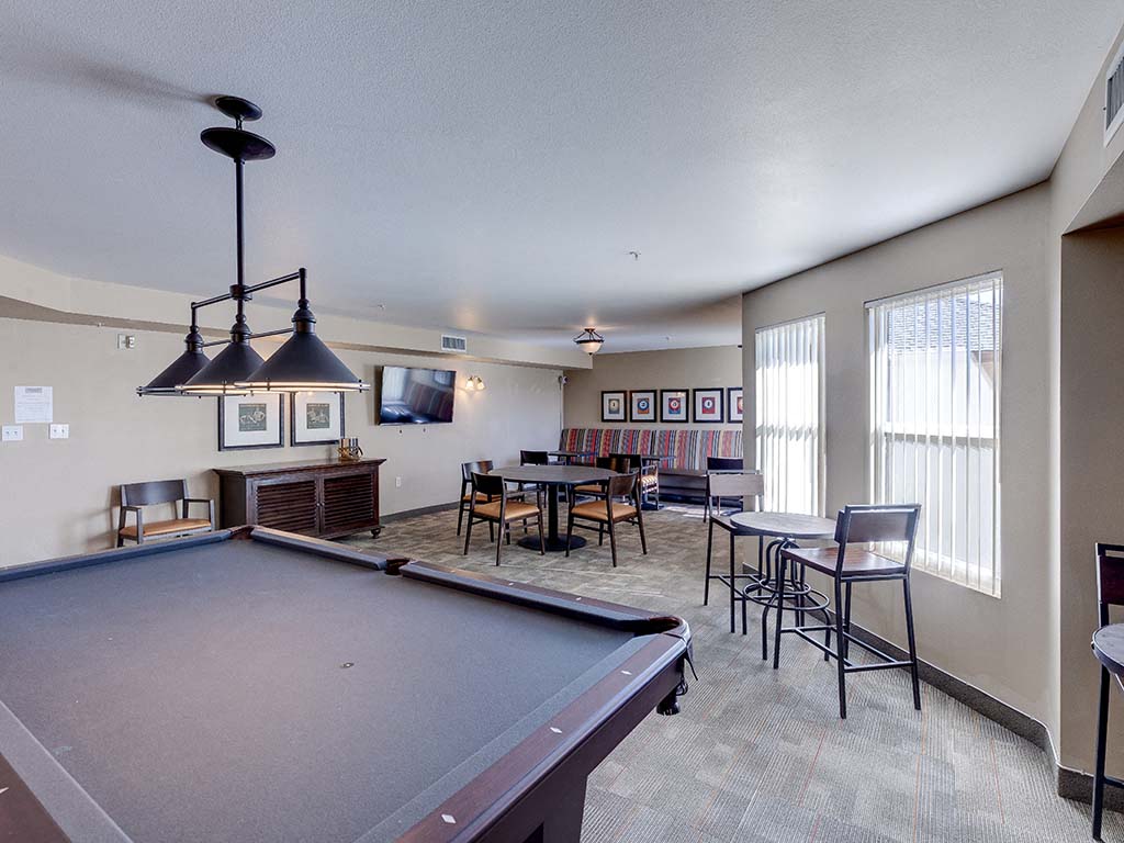 Pool table with seating area  l Vintage at Bouquet Canyon Senior Apartments