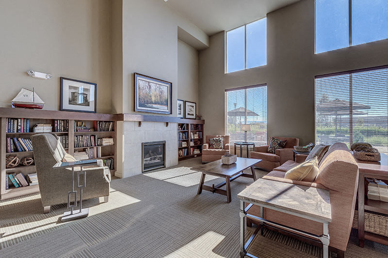 a living room with a couch and a fireplace